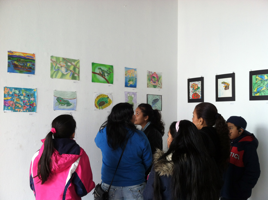 family admires environmental and frog art at 58 Gallery in Jersey City