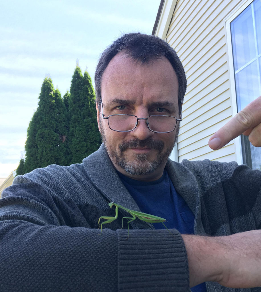 John Cichowski, teacher with praying mantis