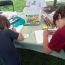 children-drawing-at-frogs-are-green-tent-city-of-water-day-hoboken-nj thumbnail