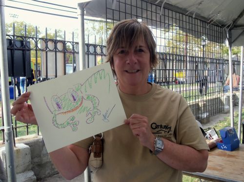 Laura Skolar displays her frog drawing at WPLIVE
