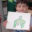 Young-boy-draws-a-frog thumbnail