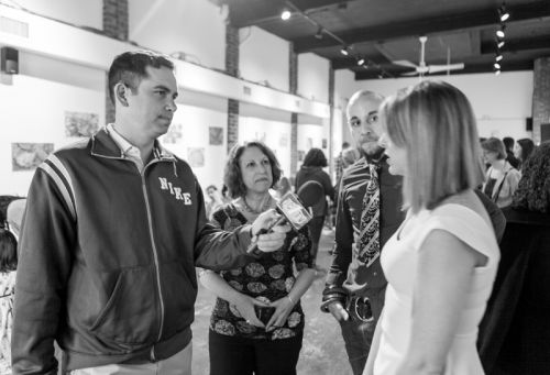 Mayor Steven Fulop discusses the Green Dream Exhibition event at The Distillery Gallery with Susan Newman, Kristin DeAngelis and Gabriel Pacheco.