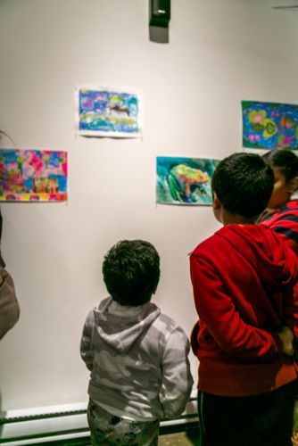 Children admiring the frog art at the Green Dream exhibition in Jersey City on Earth Day. Photo by Danny Chong.