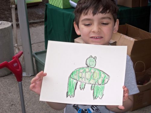 Young-boy-draws-a-frog