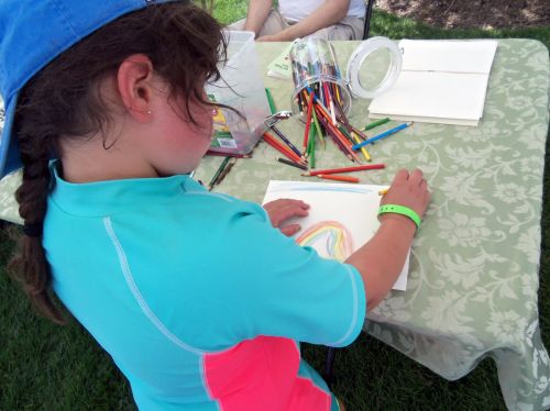 City of Water event draws parents and children and Frogs Are Green inspires drawing.