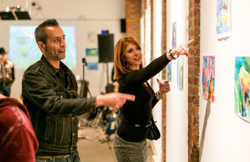 Kristin DeAngelis talks about frog art during the Green Dream opening at The Distillery Gallery in Jersey City. Photo by Danny Chong.