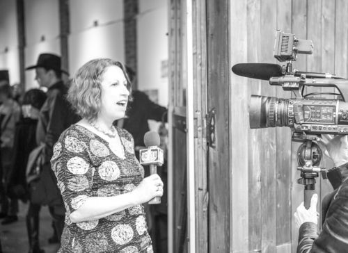 Susan Newman, founder of Frogs Are Green being interviewed by JC1TV at the Green Dream - Save The Frogs Day event, The Distillery Gallery in Jersey City. Photo by Danny Chong.