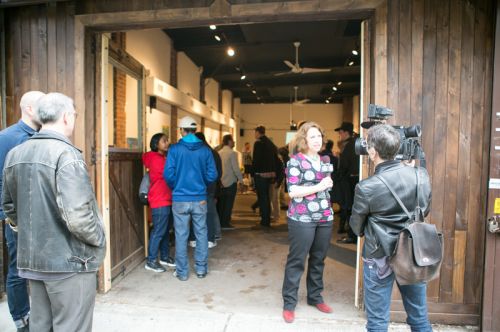 Susan Newman, founder of Frogs Are Green being interviewed by a JC1TV reporter at the Green Dream - Save The Frogs Day event, The Distillery Gallery in Jersey City. Photo by Danny Chong.