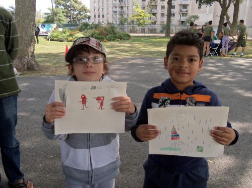 Two boys hold up their frogart at WPLIVE