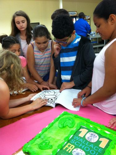children-look-for-their-names-in-wallace-school-book