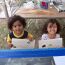 two-youngsters-drawing-with-frog-stickers thumbnail
