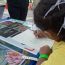 girl-creates-beautiful-frog-drawing thumbnail
